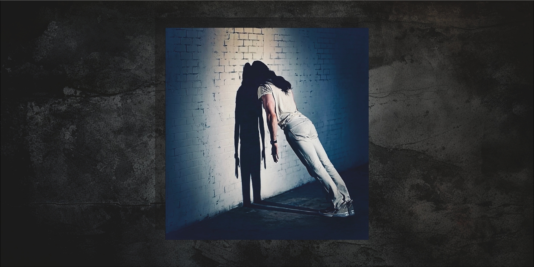 awk leaning against a wall with shadow cast